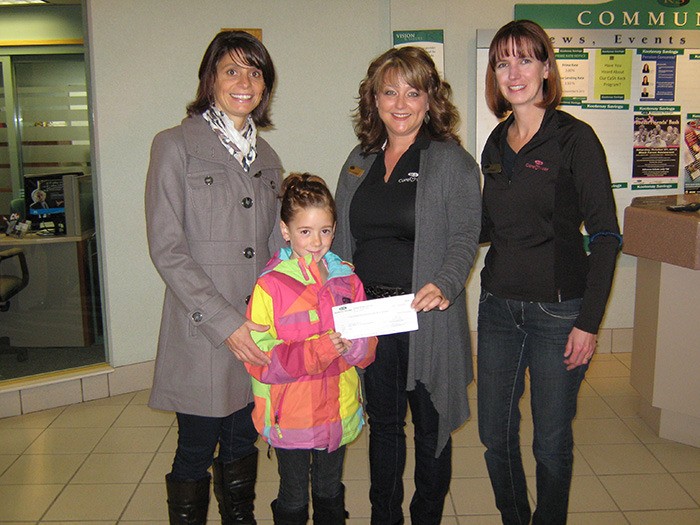 (l-r) EMP principal Lisa Tenta and student Madison Roe are presented a cheque in the amount of $1