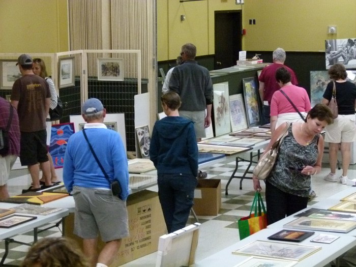 Art lovers peruse the inventory of last year's Art From the Attic art sale at the Invermere Community Hall.