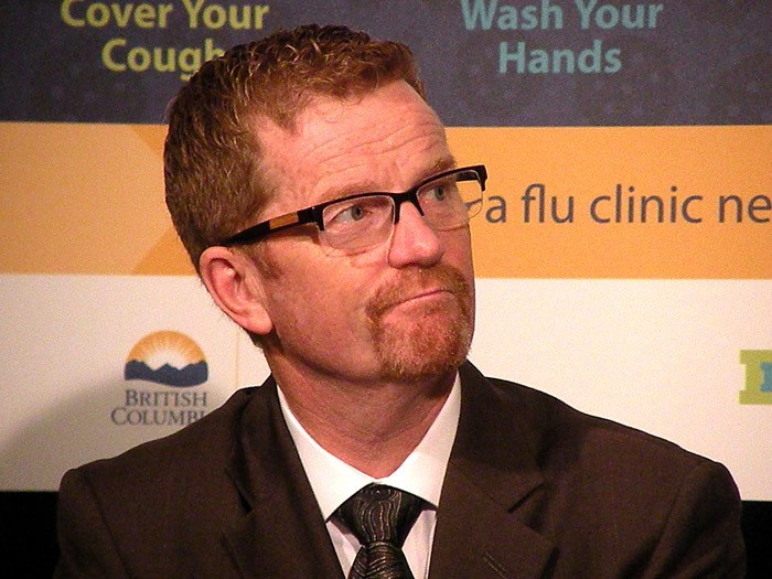 B.C. Health Minister Terry Lake attends a flu vaccine clinic in 2015.