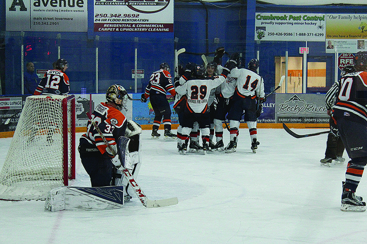 Rockies' players look on as the Beaver Valley Nitehawks celebrate one of their trio of goals on Saturday night. Columbia Valley