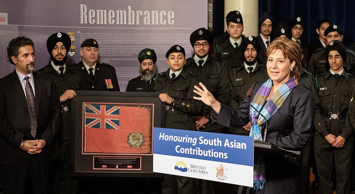 Steven Purewal (left) presents 1874 Red Ensign flag to Premier Christy Clark