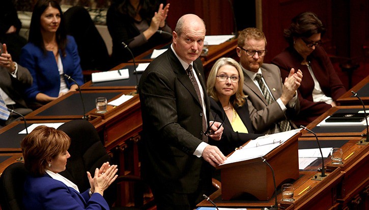 Premier Christy Clark applauds Finance Minister Mike de Jong's budget speech