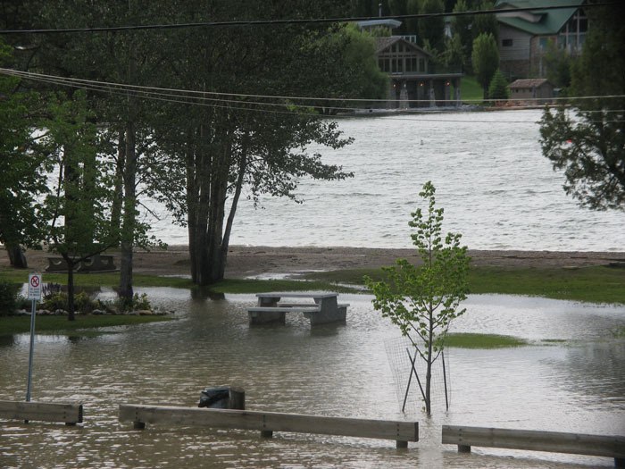 Heavy rainfall on Tuesday (June 26) resulted in flooding of the parking lot and adjacent green space at Kinsman Beach in Invermere