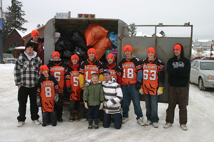 2010 ­— The Bighorns' football team along with some friends stand next to just a small amount of the bottles and cans they collected as part of a recycling drive to collect money for the team's upcoming season. Residents from all over the Columbia Valley stepped up and donated to the project.