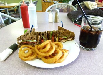 The clubhouse sandwich with onion rings at Kari's Kitchen.