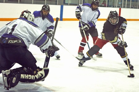Lindsay Johnston of the Canal Flats Vipers hockey team makes an attempt on the Calgary net during the 2011 Oldtimers' Hockey Tournament held over the weekend at the Eddie Mountain Memorial Arena. This year 17 teams