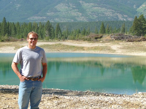 Developer and water sports enthusiast Jon Martin stands near the not-yet-completed Heritage Lake