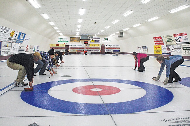October 2011 — 2006 Olympic curling bronze medallist Christine DuBois (right) was one of six volunteers who took the time to teach a curling workshop to prospective curlers at the Invermere Curling Club on Saturday