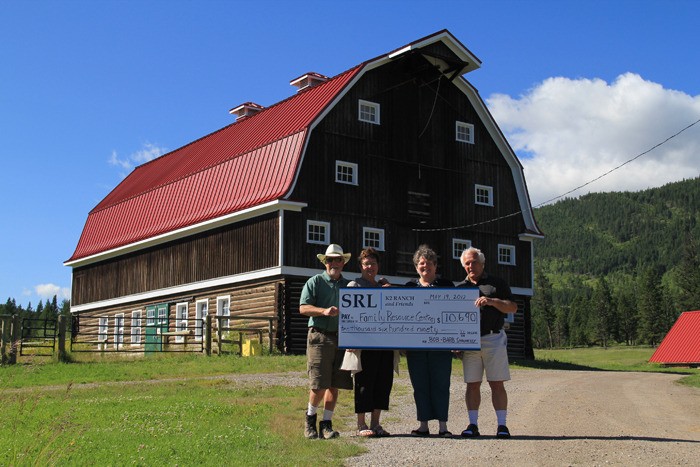 K2 ranch owners Bob and Barb Shaunessy (left) present the $10