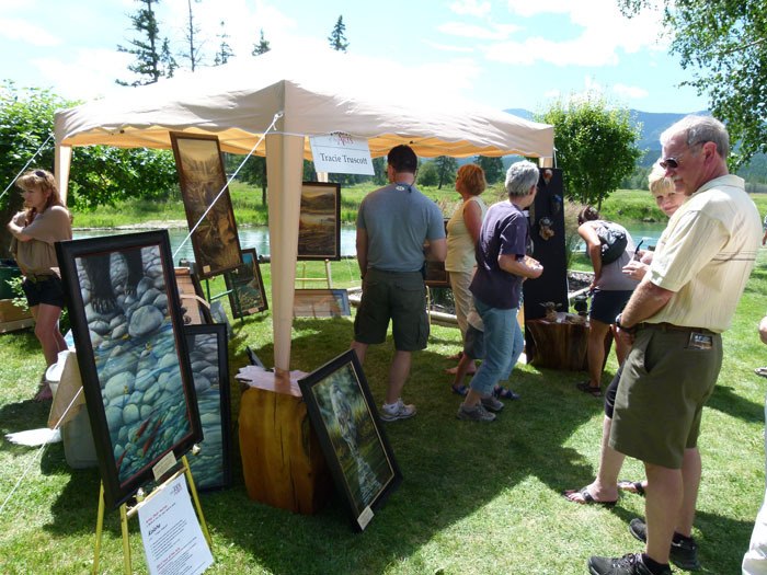 Members of the public enjoy artist Tracie Truscott's display at the 2011 Tour of the Arts last July.