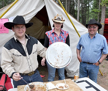 A chili booth gets ready to serve up and compete.