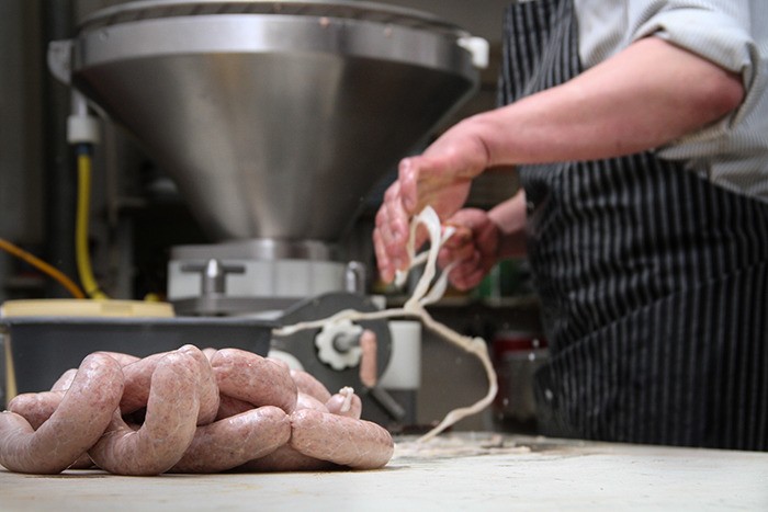 The Konig sausage-making process gets into full swing.