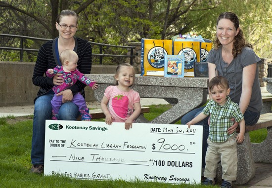 Books for B.C. Babies receives a cheque.