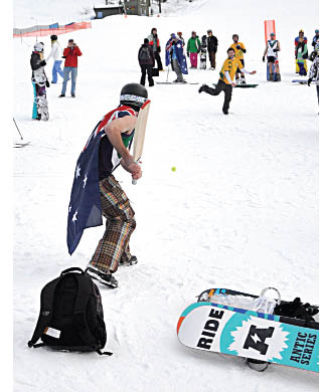 Australians were showing their true colours at Panorama while celebrating their national day on January 26. Skiers and snowboarders hit the chilly slopes with flags while (pictured top) a game of cricket broke out at the bottom of the mountain.   darryl Crane/echo photo