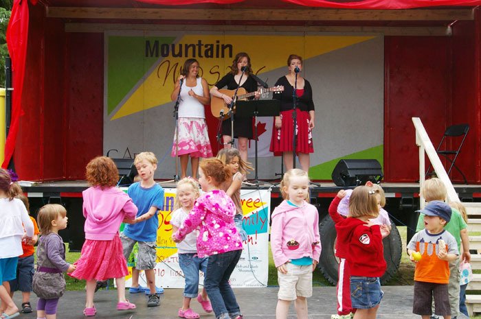 Children dance to live music at the entertainment stage during last year's Mountain Mosaic Festival of the Arts at Kinsmen Beach in Invermere on Canada Day.