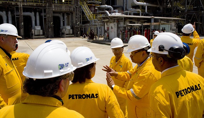 Natural Gas Minister Rich Coleman (left) and Premier Christy Clark tour PETRONAS natural gas import terminal in Malaysia in May.