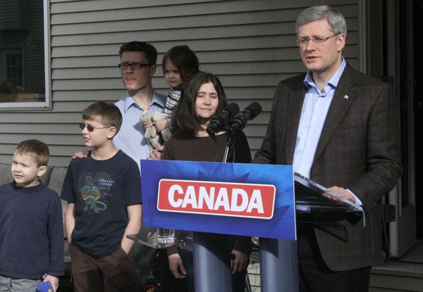Prime Minister Stephen Harper makes a family tax break announcement with the Wellburn family of Saanich Monday.