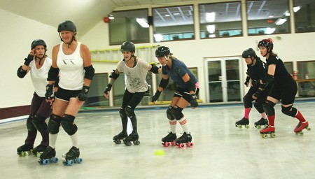 The Killer Rollbots warm up during a practice.