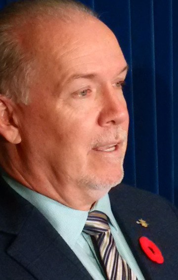NDP leader John Horgan speaks to reporters in Victoria Wednesday.