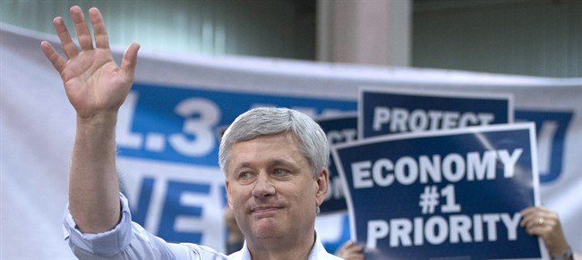 Conservative Leader Stephen Harper waves at a campaign event at the J.P. Bowman tool and die company in Brantford