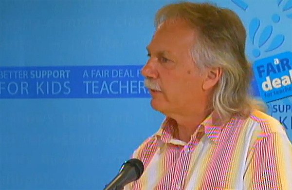 B.C. Teachers' Federation president Jim Iker speaks to reporters in Vancouver Wednesday.