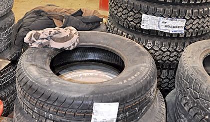 Stockpiled tires at a local auto-mechanic business.