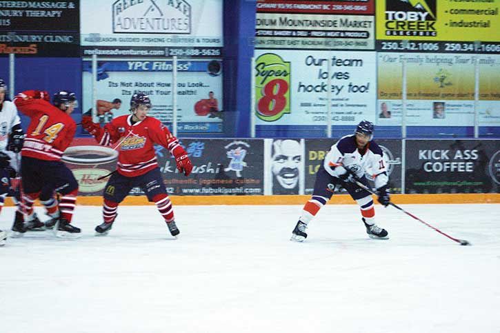 Rockies player Malcolm Fenelon looks down the ice preparing to let the puck fly at the Eddie Mountain Memorial Arena in Invermere on Friday