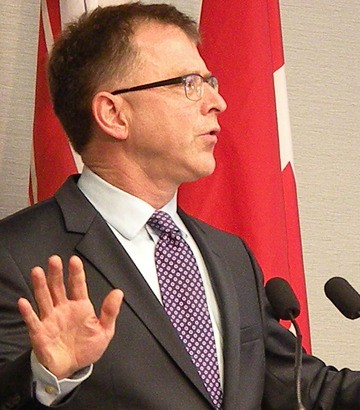 NDP leader Adrian Dix announces he will step down as leader by the middle of 2014 'at the latest.'
