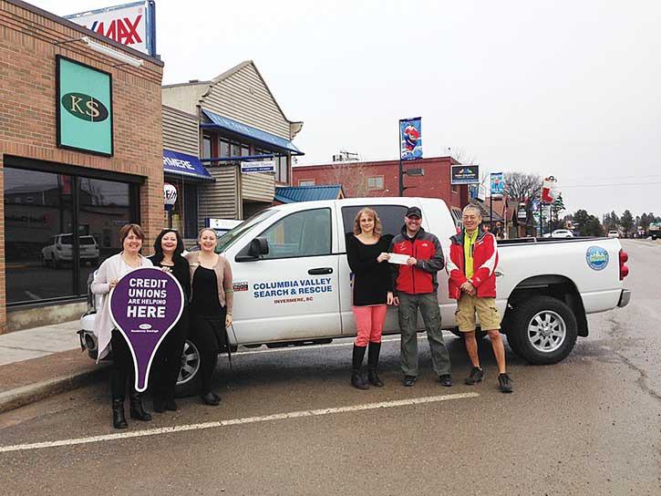 Kootenay Savings Credit Union Invermere branch staff present Columbia Valley Search and Rescue with their $5