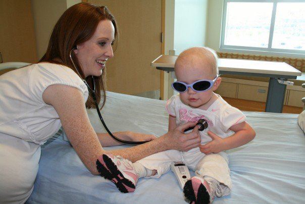 Kiera Neal at 15 months old being checked in by nurse Jenny for her amputation surgery in September 2007 at the Alberta Children's Hospital.