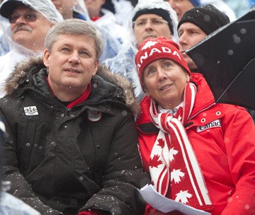 Senator Nancy Greene Raine watches Olympic ski event at Whistler with Prime Minister Stephen Harper