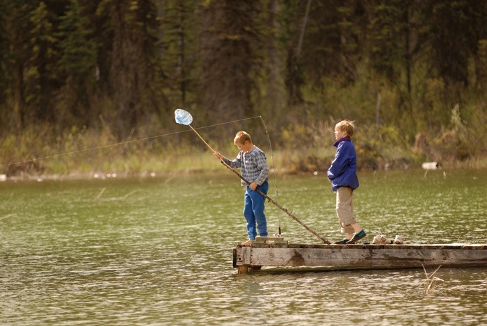 June 2007 — Many backcountry lakes in the Columbia Valley were teeming with fish. The spring fishing season was going well as these two boys found out while visiting Cartwright Lake