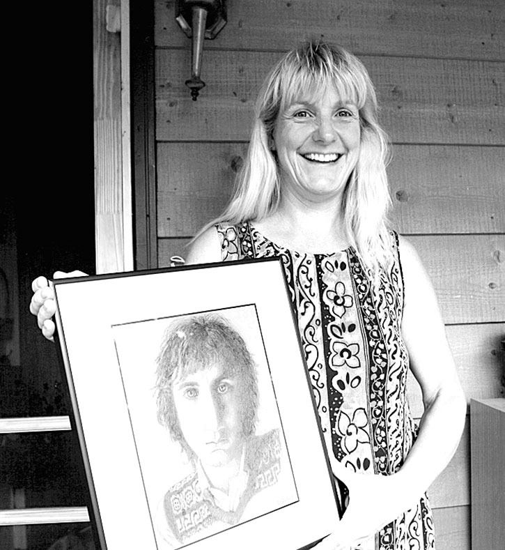 2006 — Dale Foster holds a copy of the sketch she drew of rock guitar legend Peter Townshend. What began as a schoolgirl crush on drummer Keith Moon turned into a lifelong infatuation with The Who for the Windermere resident.