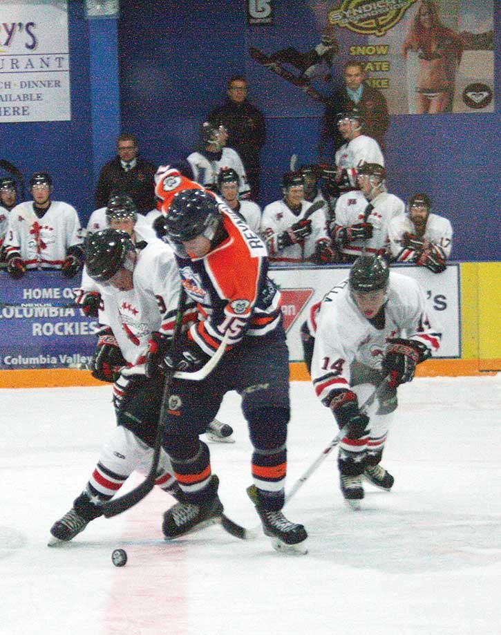 Rockies player Will Reynish fights to stay in control of the puck in the Columbia Valley’s season opener against the Kimberley Dynamiters on September 11th at the Eddie Mountain Memorial Arena.