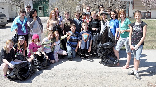 Students from J.A. Laird Elementary School pitch in to clean up around the community as part of last year's Earth Day celebrations.