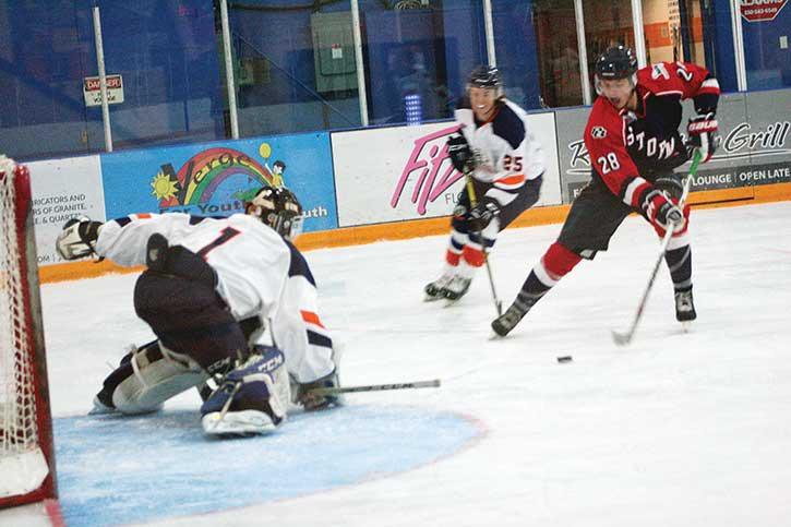 Columbia Valley Rockies goalie Connor McKay gets low in front of a Kamloops forward at the Eddie on September 12th.