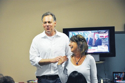 Re-elected NDP MLA Norm Macdonald celebrates with his wife Karen at his campaign office in Golden the evening of Tuesday