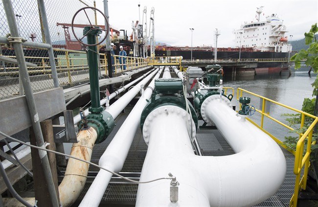 A ship receives its load of oil from the Kinder Morgan Trans Mountain Expansion Project's Westeridge loading dock in Burnaby