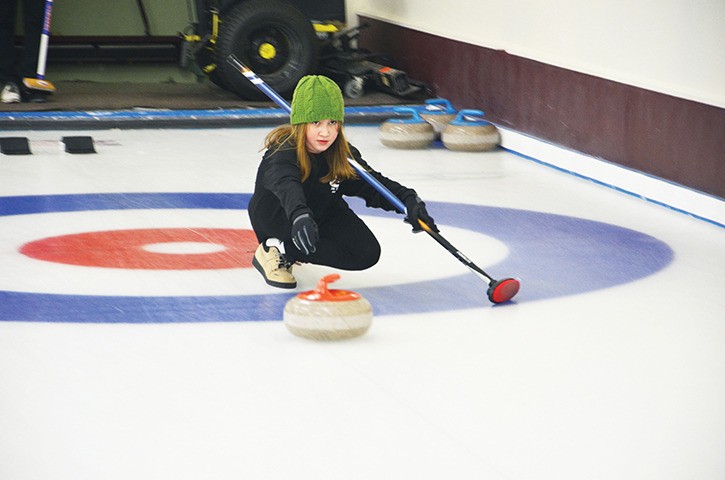 Anna Stevens sends a rock down the ice during the Invermere Curling Club’s first Turkey Bonspiel in almost a decade on Sunday