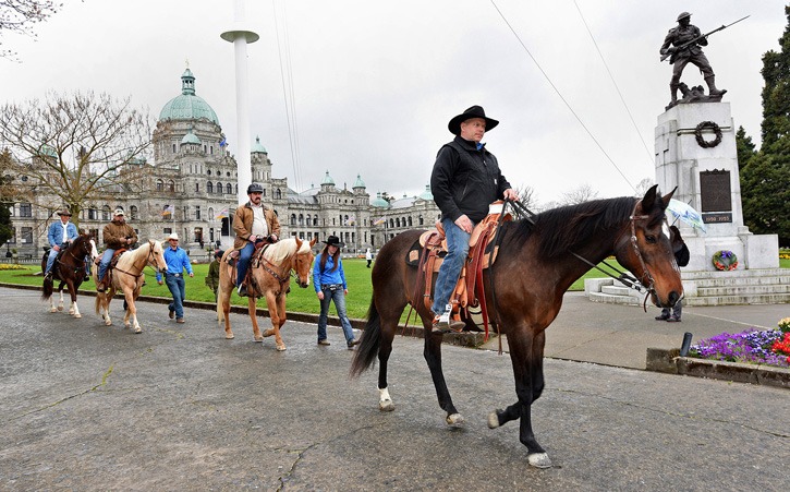 Paul Nichols leads fellow Canadian Forces veterans at the start of cross-country ride at the B.C. legislature Monday.