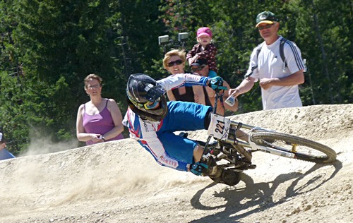 Riders rockets down the race track at the 2011 Canadian DH Mountain Bike Championships at Panorama