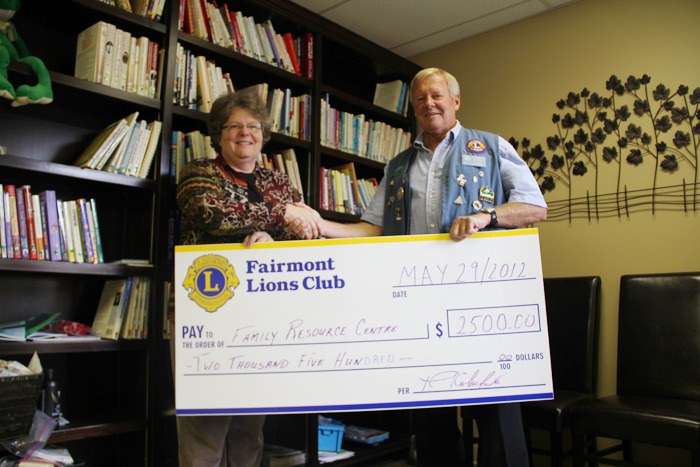 Family Resource Centre of Invermere executive director Pat Cope graciously accepts a cheque from Fairmont and District Lions Club president Ray Kolochuk.