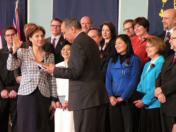 Premier Christy Clark and her new cabinet are sworn in by Lieutenant Governor Steven Point at Government House in Victoria Monday.