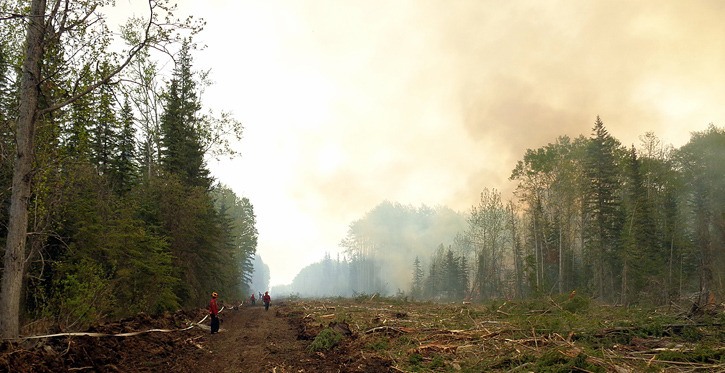 B.C. Wildfire Service crew works on firebreak to contain the Halfway River fire