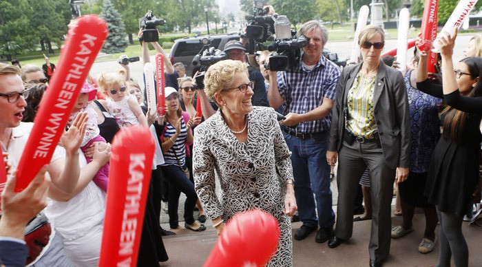 Ontario Premier Kathleen Wynne arrives at provincial legislature June 13 after her election victory.