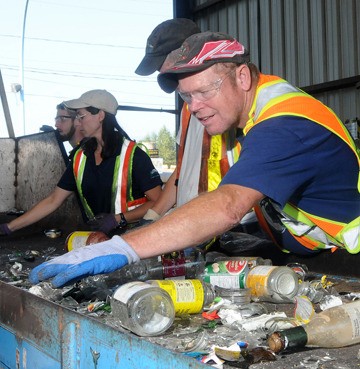 Richard Niesman sorts bottles at Maple Ridge recycling depot