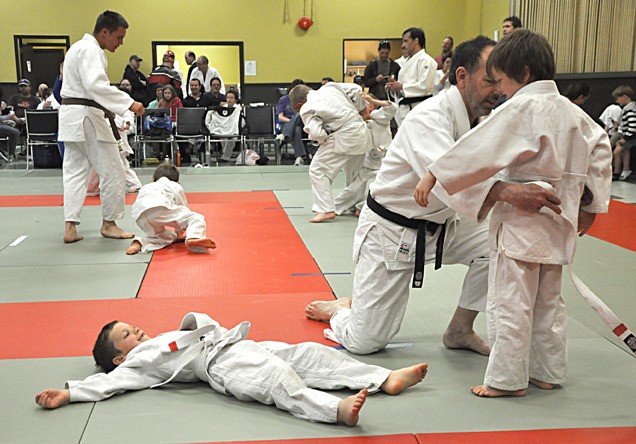 Judo students take a quick break to recuperate and fix their belts during the Judo championships held in Invermere on May 14.