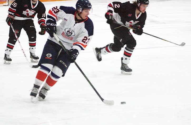 Rockies player Nolan Menard (#23) manoeuvres the pucks with two Dynamiters hot on his heels during Columbia Valley’s game against Kimberley at the Eddie Mountain Memorial Arena on Friday