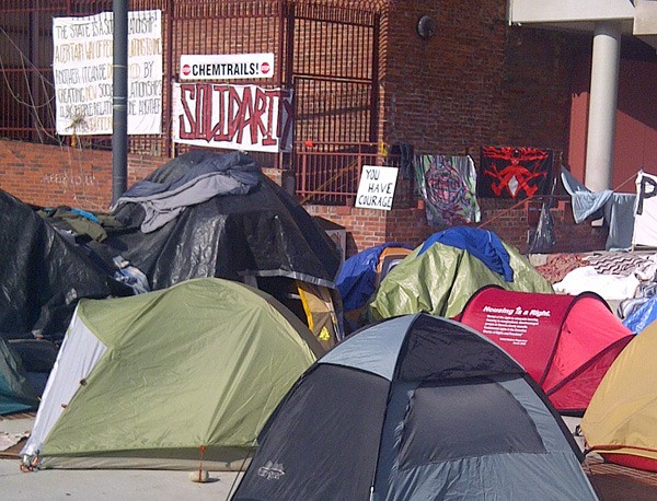 Occupy Victoria camp: signs warning against 'chemtrails' and smart meters are a sideshow. The consistent message is a demand to dismantle capitalism and nationalize banks.