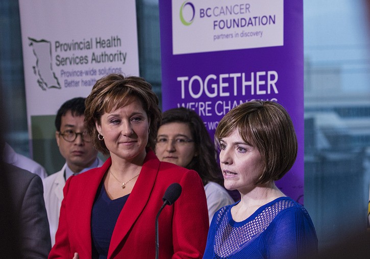Premier Christy Clark listens as Jennifer Strack describes her successful treatment for lung cancer.